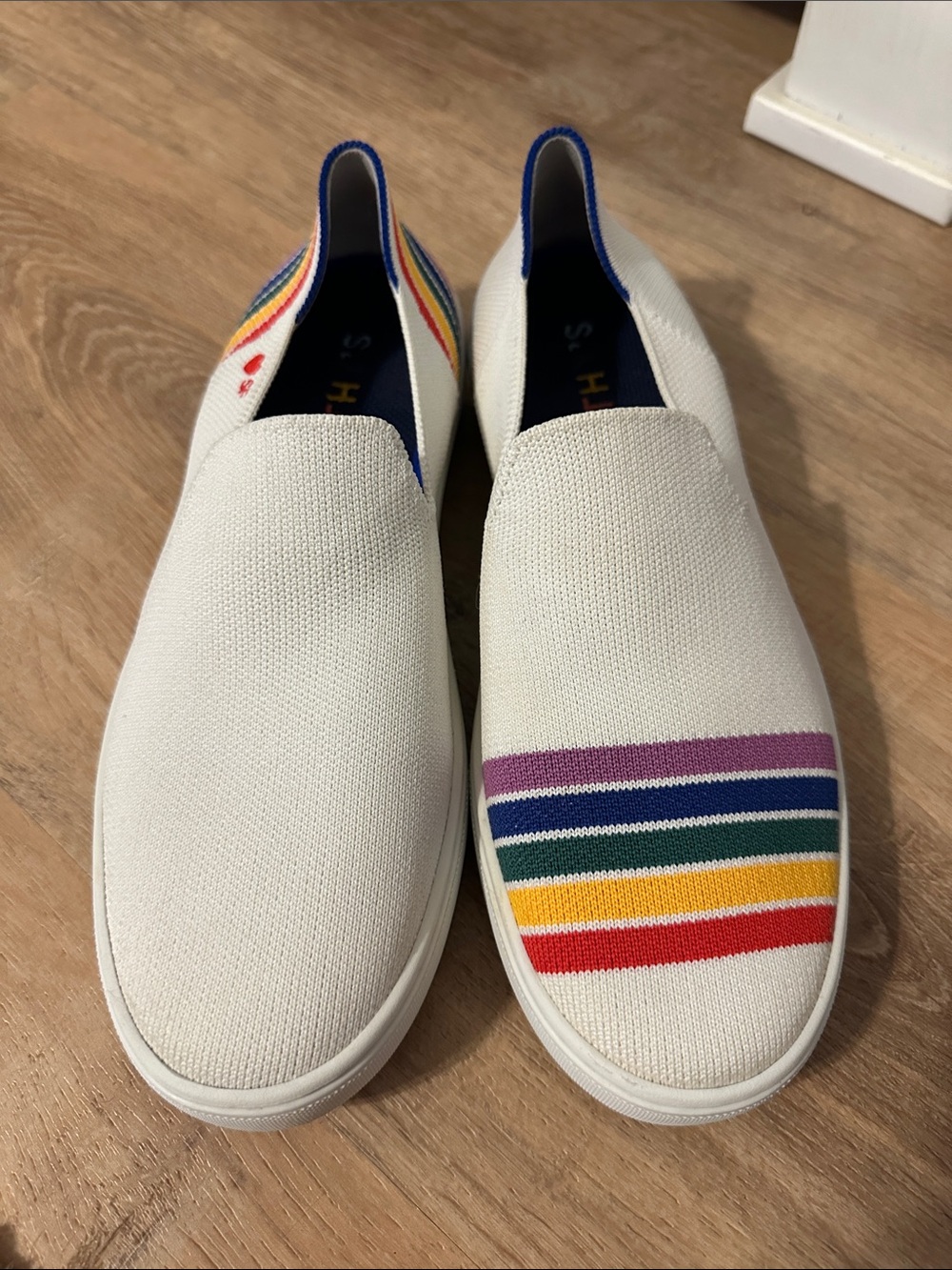 Rothy's White Slip-On Sneakers with Rainbow Stripes